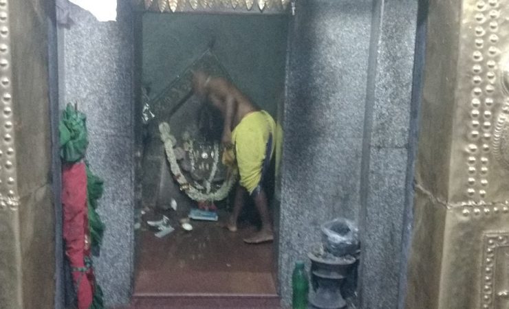 A Priest On Duty In Maldakal Temple